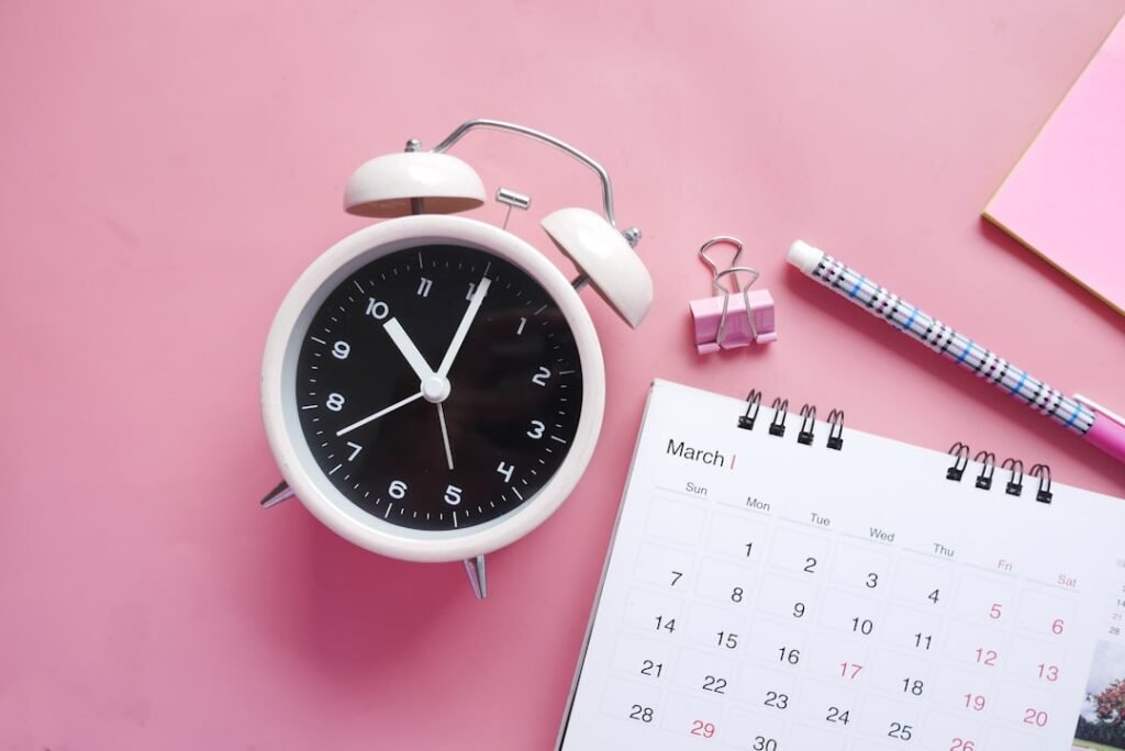 Analog clock showing 2 AM springing forward to 3 AM with March 8 2026 calendar